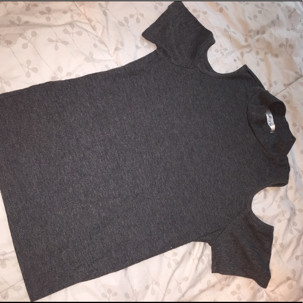 Tight fitting gray turtleneck shirt